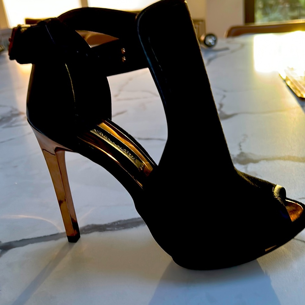 Gorgeous original BCBG black suede peekaboo cutout ankle heel with a bronze heel